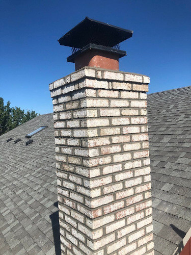 A brick Chicago chimney repaired by RK Masonry contractor.